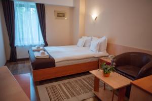 Ліжко або ліжка в номері Hotel Marami