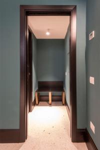 a hallway with a bench in a room at Residence Poli Venezia in Venice