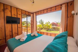 Cama ou camas em um quarto em Pao Pao Lodge Algarrobo