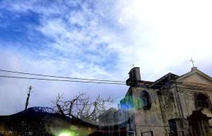 an old church with a cross on top of it at B&B Guest Armonie in Torre del Greco