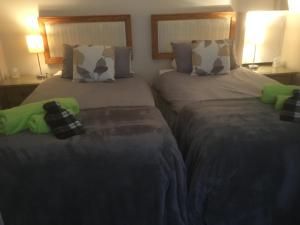 A bed or beds in a room at Otters Green