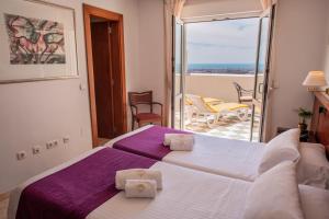 A bed or beds in a room at Villa Guadalupe