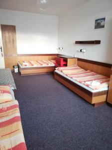 a hotel room with two beds in a room at ABC Hotel Nitra in Nitra