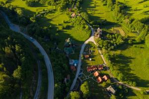 an aerial view of a road in a green field at Apartments Milev in Mokra Gora