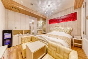 Кровать или кровати в номере Hotel Luna Ibaraki(Adult Only)