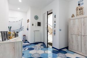 a room with a blue and white tiled floor at A casa di Monachella in Gaeta