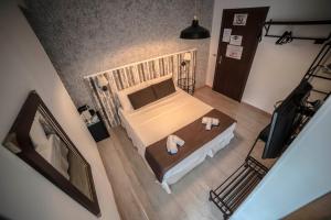 Galleria Frascati Rooms and Apartment में एक कमरे में एक या कई बेड