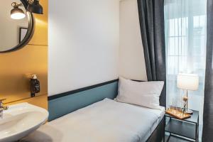 เตียงในห้องที่ Pop Up Hotel Krone Zürich