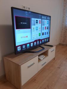 A television and/or entertainment centre at Lux Apartment in the City Center