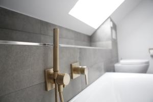 a bathroom with a sink and a toilet at Rooftop Moselsuite in Cochem