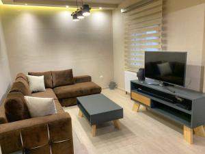 Area tempat duduk di Petite Luxury Urban House