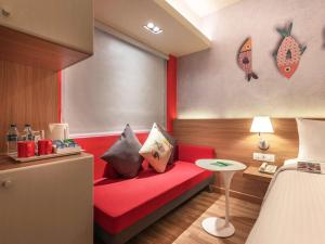 A bed or beds in a room at ibis Kolkata Rajarhat - An Accor Brand