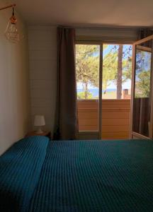 A bed or beds in a room at Résidence Les Pins