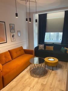 Svetainės erdvė apgyvendinimo įstaigoje Apartament BellaPola Loft