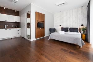 Кровать или кровати в номере Apartamenty Paliki