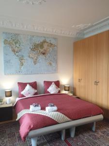 a bedroom with a large bed with a map on the wall at Antonius Bed and Breakfast in Arnhem