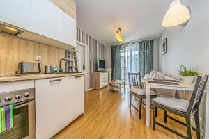 Virtuve vai virtuves zona naktsmītnē Apartament Lemon