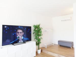 TV a/nebo společenská místnost v ubytování Guest House - La bella vita