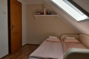 A bed or beds in a room at Lagom Apartman