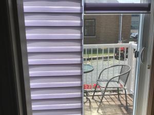 a stack of purple siding on a balcony at Petit Hôtel Amara in La Malbaie