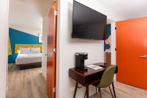 A bed or beds in a room at 4411 Inn & Suites