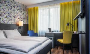 Posteľ alebo postele v izbe v ubytovaní Thon Hotel Tromsø