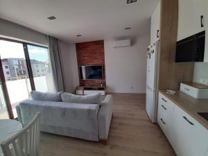 Televizors / izklaižu centrs naktsmītnē Apartament LUX