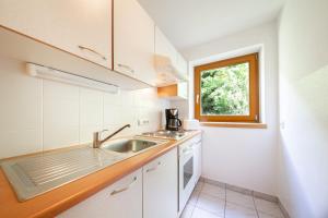 A cozinha ou cozinha compacta de Appartements Waldesrand