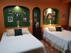 Una cama o camas en una habitación de Hotel Boutique Casona Maya Mexicana