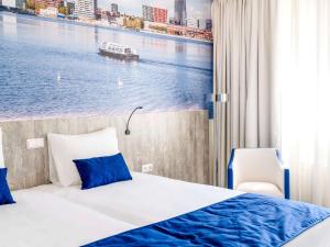 Posteľ alebo postele v izbe v ubytovaní ibis Styles Almere