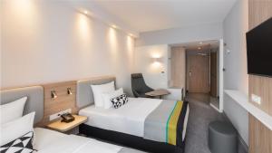 טלויזיה ו/או מרכז בידור ב-Holiday Inn Express Munich - City East, an IHG Hotel