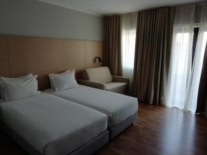 Un pat sau paturi într-o cameră la ClipHotel