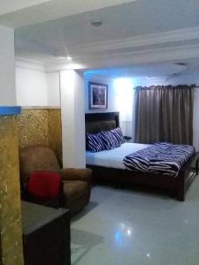 Tempat tidur dalam kamar di TheoDawn Hotels @ Suite 29