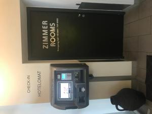 a picture of a ticket machine on a wall at HB1 Budget Hotel - contactless check in in Wiener Neudorf