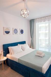 Vanilla Luxury Apartment Spa n Pool beach resort tesisinde bir odada yatak veya yataklar