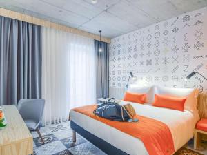 เตียงในห้องที่ ibis Styles Bucharest City Center