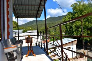 a balcony with a view of the mountains at Guest House Metreveli in Borjomi