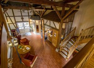 an overhead view of a living room with a person in a house at Hotel Gut Voigtlaender in Blankenburg