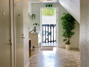 a hallway with a door leading to a porch at Löderup Strandbad Hotell och Restaurang in Löderup