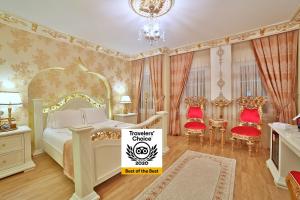 a bedroom with a bed with a sign that reads traveler queens at White House Hotel Istanbul in Istanbul