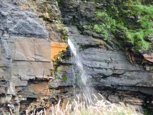 een waterval aan de kant van een rots bij The Collins,Our View from The Top in Listowel