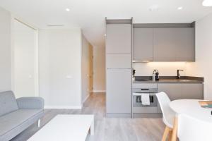 A cozinha ou cozinha compacta de Sitges Vibe Apartments by Olala Homes