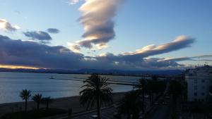 a view of the ocean and a cloudy sky at Apartamentos Ferrán Paqui in Roses