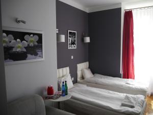 מיטה או מיטות בחדר ב-Residence B&B La Fontaine Aparthotel