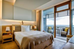 Katil atau katil-katil dalam bilik di BUDERSAND Hotel - Golf & Spa - Sylt