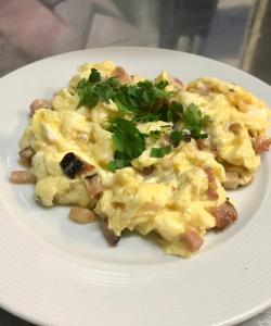 een witte plaat met een hoop voedsel bij U Námořníka-Restaurant a penzion in Hukvaldy