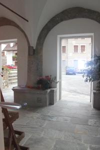 a hallway with a door leading to a street at Albergo Alle Alpi in Comeglians