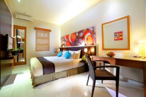 Tempat tidur dalam kamar di The Banyumas Villa