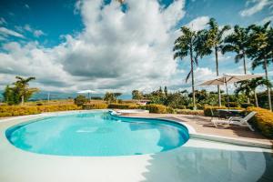 Swimmingpoolen hos eller tæt på Hotel Arrayanes del Quindío