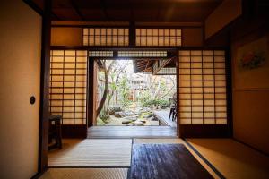 A bed or beds in a room at Guest House Koiya